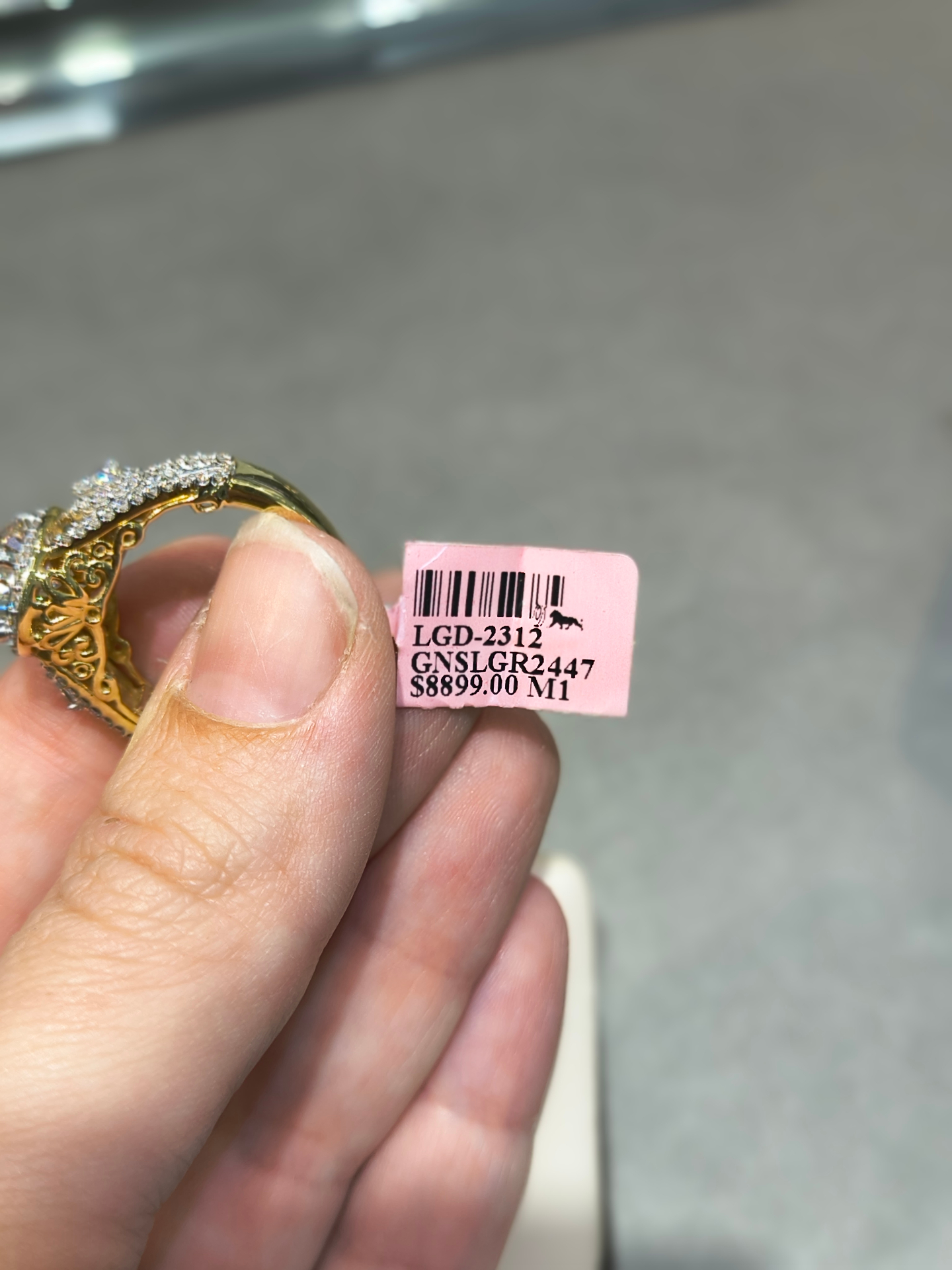 Yellow gold statement ring with diamond accents and intricate filigree band